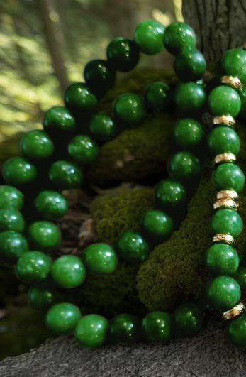 House of Joy green beaded bracelets with 18k G accents on a tree branch